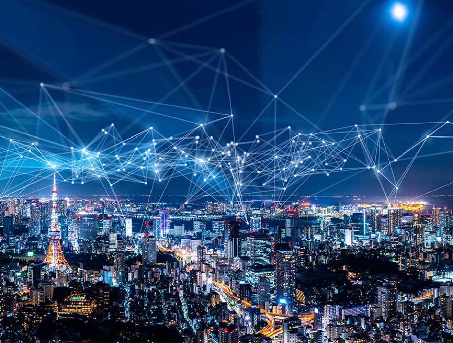 City skyline overlaid with a telecom network mesh